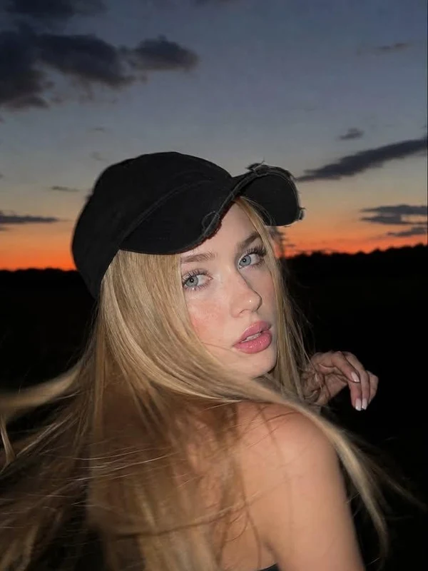 Woman turning in soft golden sunset light